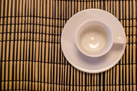 Empty cup on bamboo napkin Stock Photos