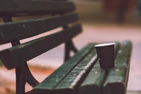 Empty cup of coffee on the bench Stock Photos