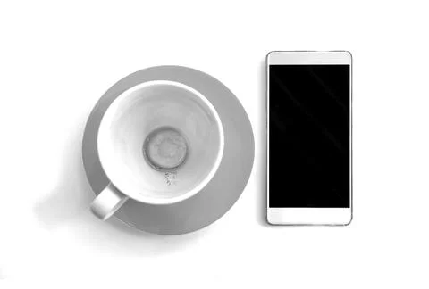 Empty cup of finished drinking coffee with smartphone on white background 스톡 사진