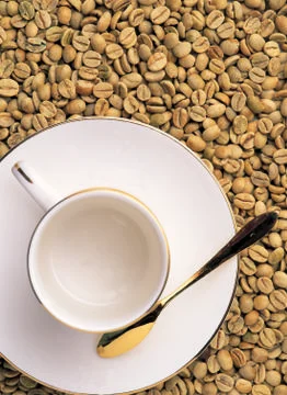 Empty cup with play lie on the coffee beans Stock Photos