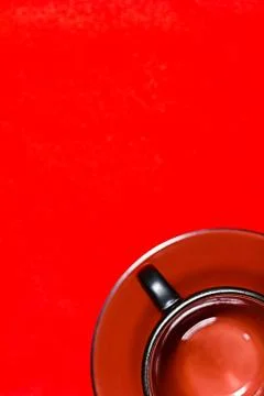 Empty cup on a red background Stock Photos