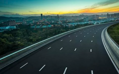 Empty curvy modern LED light highway asphalt road Stock Photos