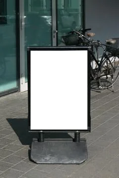 Empty customer stopper standee sign on pavement Stock Photos