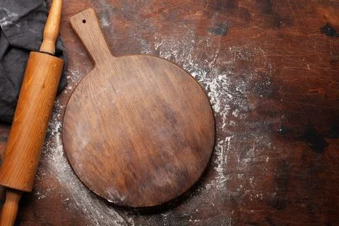 Empty cutting board on kitchen table Stock Photos