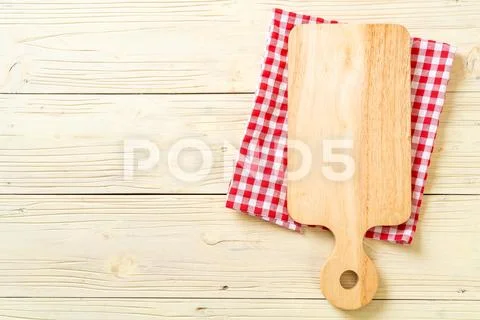 Empty cutting wooden board with kitchen cloth Stock Photos