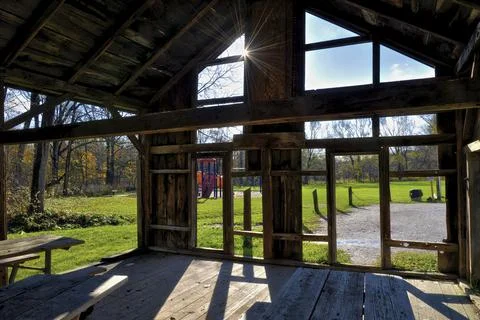 Empty damage barn house with lens flare Stock Photos