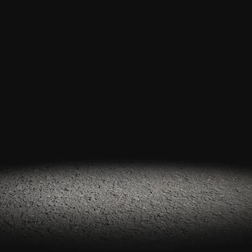 Empty dark asphalt surface illuminated by a dim spotlight against a black b.. Stock Photos