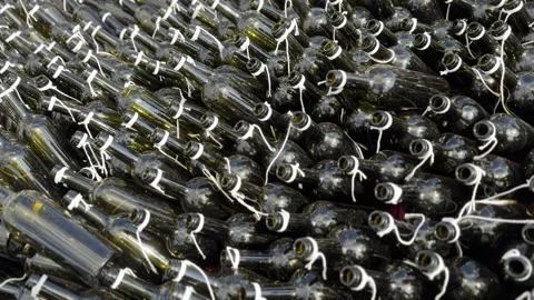 Empty dark wine bottles in close-up at an exhibition and sale of high-quality Stock Footage 316421190