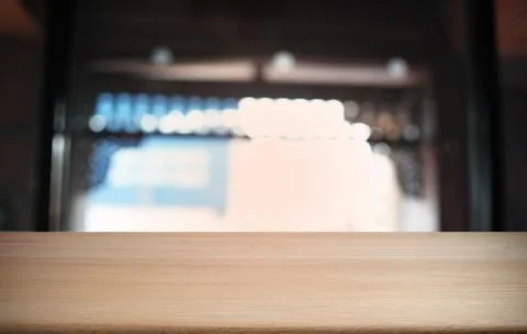 Empty dark wooden table in front of abstract blurred bokeh background of rest Stock Photos