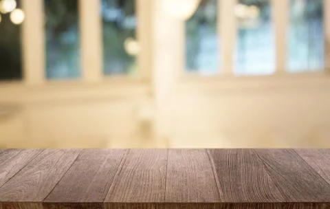 Empty dark wooden table in front of abstract blurred bokeh background of rest Stock Photos