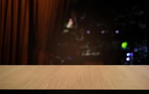 Empty dark wooden table in front of abstract blurred bokeh background of rest Stock Photos