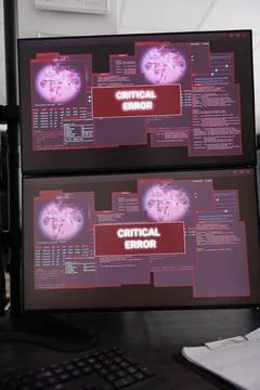 Empty data room with multiple monitors showing hacking attack alert 스톡 사진