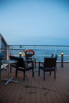 Empty deck on a car ferry with tables and chairs Foto stock