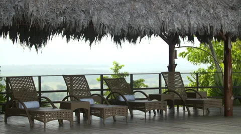 Empty deck chairs sit on pool deck at luxury hotel Stock Footage 68738843