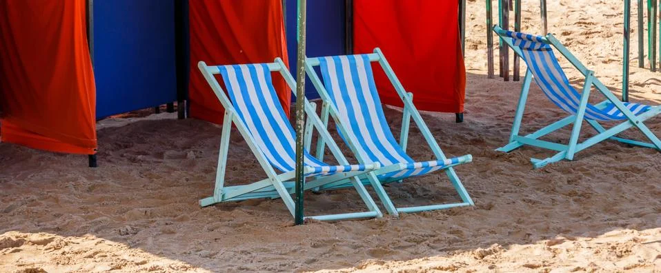 Empty deckchairs on a beach Stock Photos