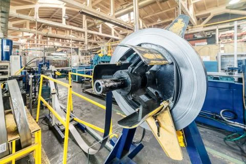 Empty decoiler of machine in metalwork manufacturing. Stock Photos