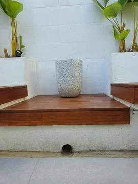 An empty decorative flower vase in one of the coffee shop areas Stock Photos