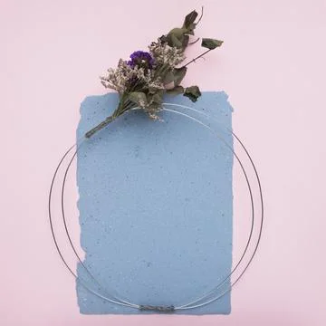 Empty decorative frame made with metallic cable flower bouquet paper pink 스톡 사진