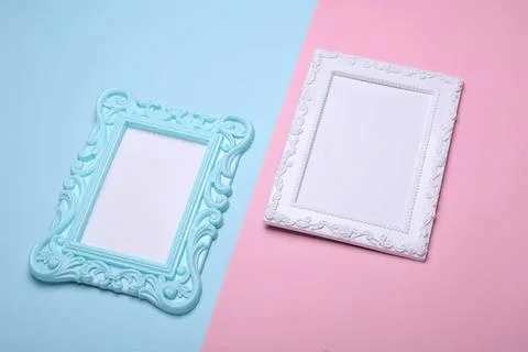 Empty decorative photo frames on pastel background Stock Photos