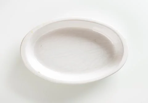 Empty deep oval porcelain baking dish Stock Photos