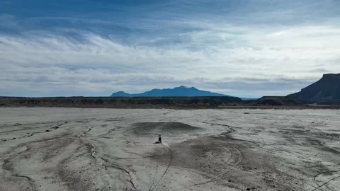 Empty Desert and mountain landscape with Dirt Biker Stock Footage 165568012
