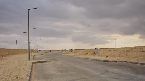 Empty desert development lot with deserted construction and street lamps in Stock-Footage 337204114