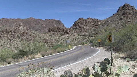Empty desert road car in distance Arizona Stock Footage 87717141