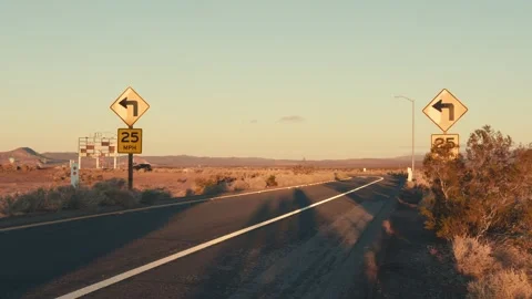 Empty desert road driving towards sunset Stock-Footage 346008197