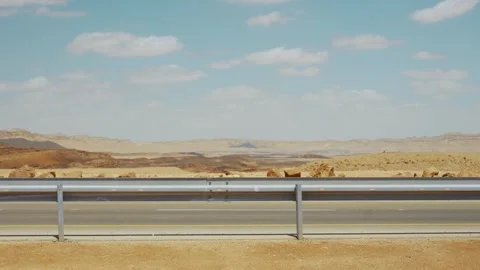 Empty desert road on hot summer day outdoors where no cars pass secluded place Stock Footage 336847532
