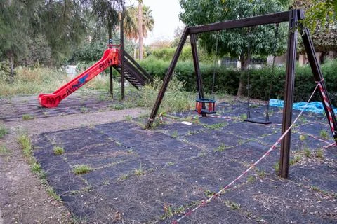 Empty deserted abandoned and closed childrens playground Stockfoto's
