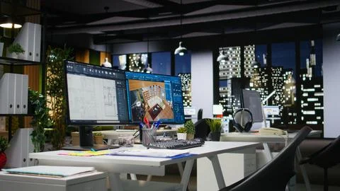 Empty design office with modern desk showcasing blueprint drafting Stock Photos