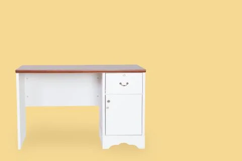 Empty desk isolated on yellow background with space for copy. 写真素材