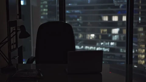 Empty desk of an office employee near a skyscraper window. Stock Footage 263232500