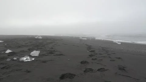 Empty Diamond Beach in Iceland with Ice Fragments on Black Sand and Thick Fog Stock Footage 339951724