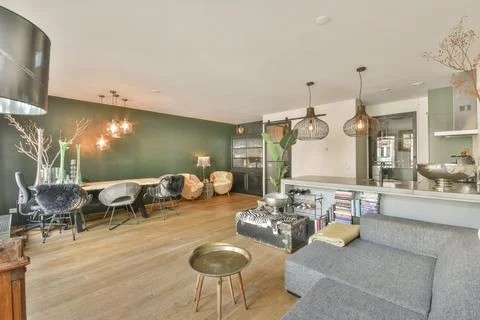 Empty dining room near kitchen Stock Photos