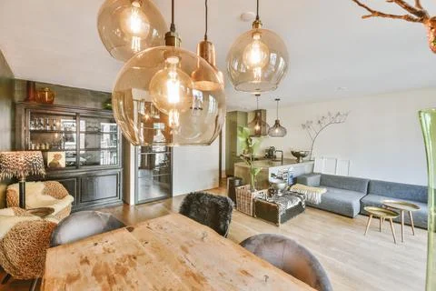 Empty dining room near kitchen Stock Photos