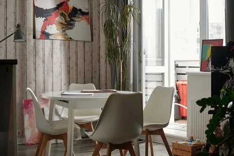 Empty Dining Table Beside Small Balcony with Wooden Wall Stock Photos