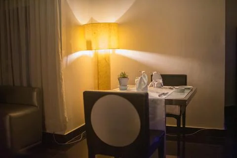 Empty dinner table in a luxurious hotel Stock Photos