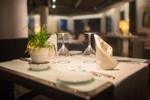 Empty dinner table in a luxurious hotel Stock Photos