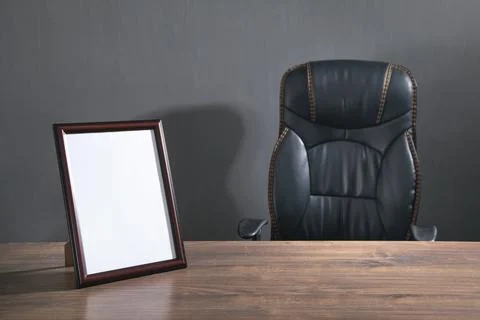 Empty diploma or certificate frame on the table. Stock Photos