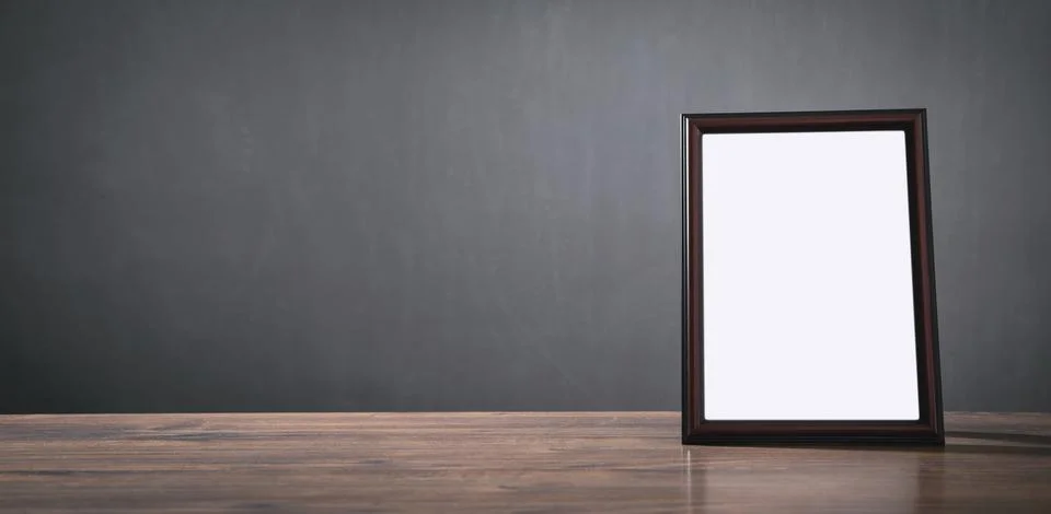 Empty diploma or certificate frame on the table. Stock Photos
