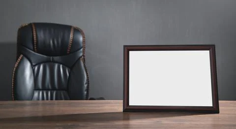 Empty diploma or certificate frame on the table. Stock Photos