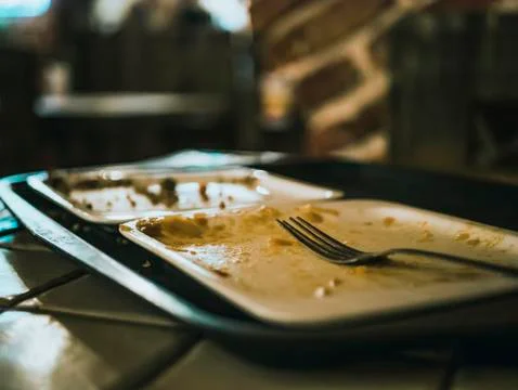 Empty dirty dish in the restaurant. Stock Photos