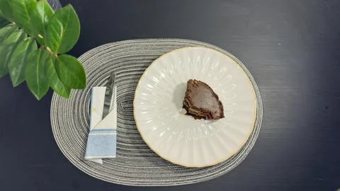 Empty dirty white plate with cake crumbs and fork after finishing dessert, .. Stock-Fotos