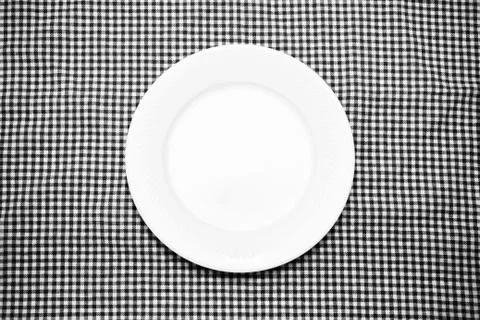 Empty dish on kitchen towel black and white color tone style Stock Photos