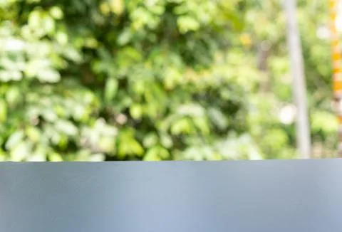 Empty Display Surface with Blurred Green Foliage Background for Product Mocku Stock Photos