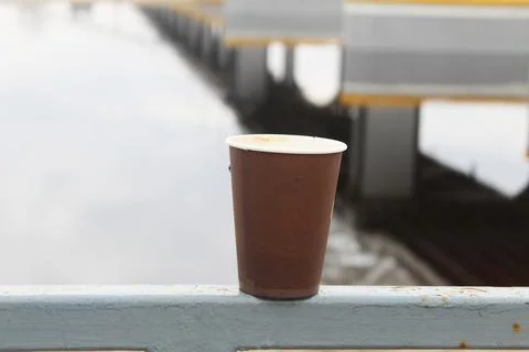 An empty disposable coffee cup. The harm of disposable tableware Stock Photos