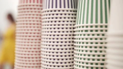 Empty disposable paper cups for coffee ice cream and other cold Stock Footage 129843461