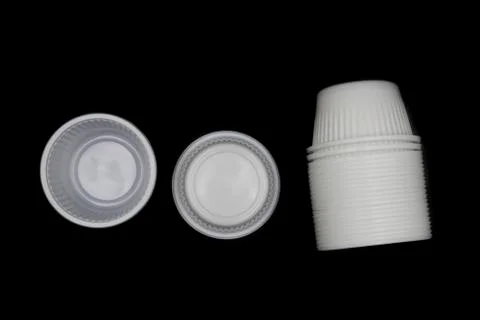 Empty Disposable Plastic Cup, Lying horizontally plastic cup isolated on blac Stock Photos