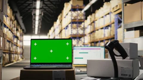 Empty distribution warehouse with mockup display on laptop Stock Photos